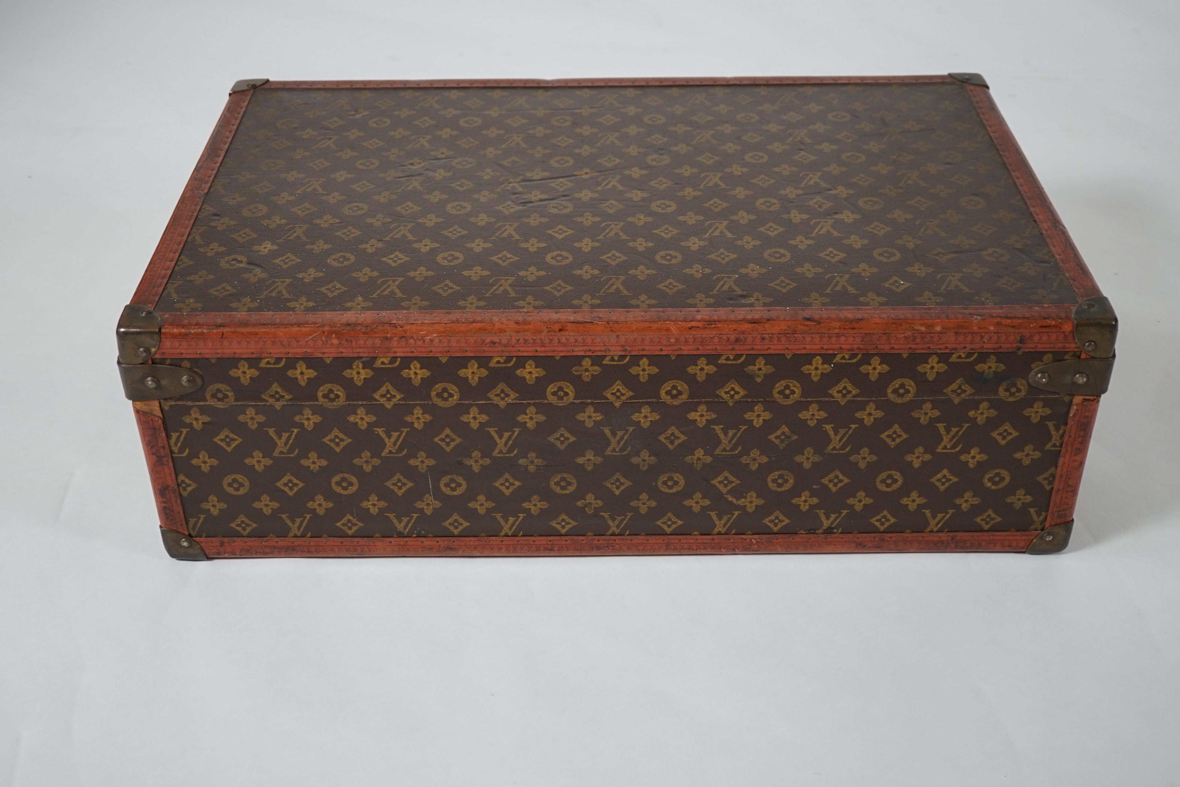A vintage Louis Vuitton monogram canvas suitcase, 71cm x 44cm x 22cm